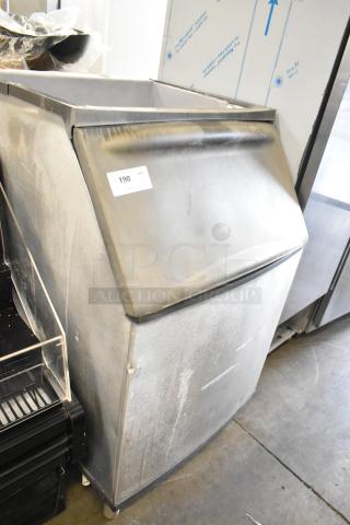 Commercial metal ice bin, industrial design, shows wear, 198 label, sturdy construction, suitable for businesses.