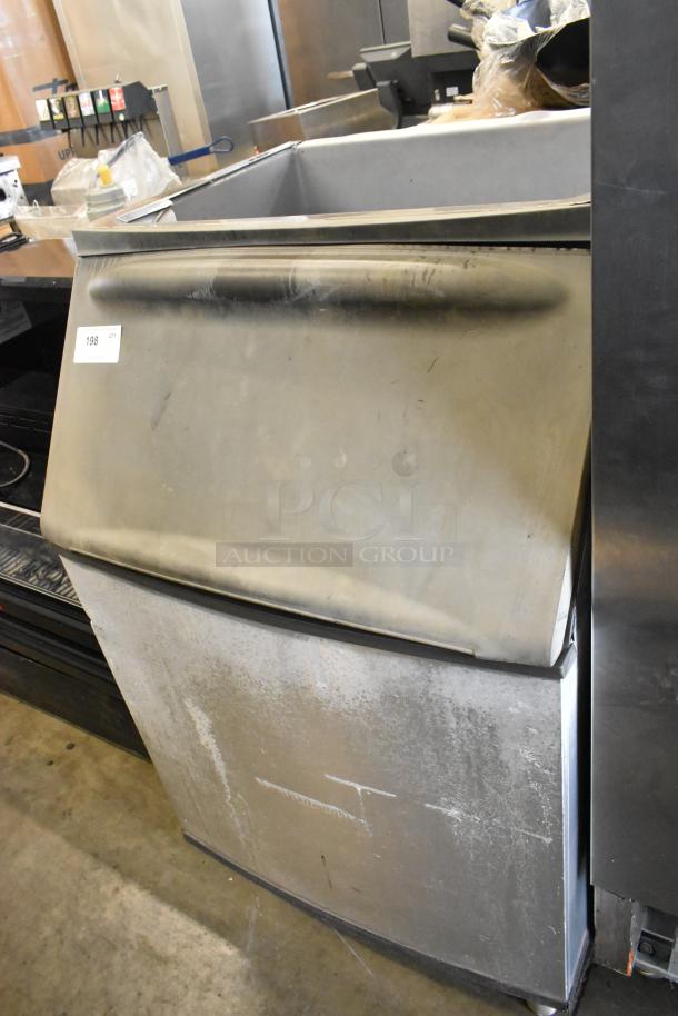 Metal commercial ice bin, used condition, stainless steel exterior, hinged lid, visible wear and scratches, auction tag 198.