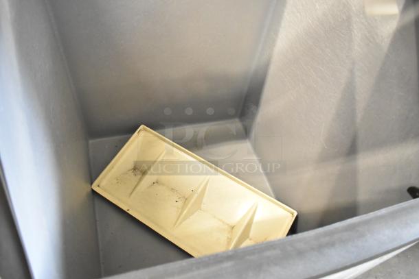 Metal commercial ice bin with interior view, showing light wear and a removable white plastic tray inside.