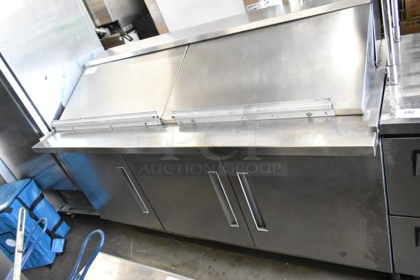 Berg EDMT7230BERG stainless steel commercial sandwich salad prep table, 115 volts, 1 phase, with sliding lid, in good condition.