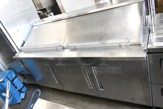 Berg EDMT7230BERG stainless steel commercial sandwich salad prep table, 115 volts, 1 phase, with sliding lid, in good condition.