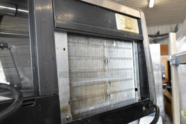 Hoshizaki HNC-180BA-L-S commercial sushi display case. Metal finish, 115V, 1 phase. Visible wear on exterior.