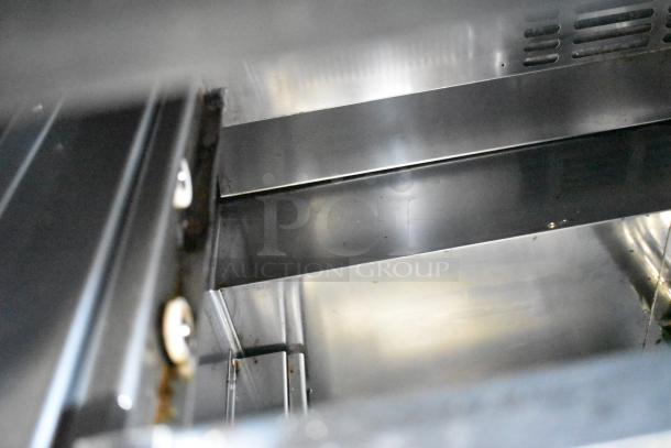 Turbo Air TUR-48SD-D4-N stainless steel interior view, showing clean condition and sturdy construction.