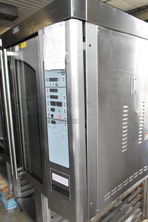Baxter OV310G stainless steel commercial natural gas mini rotating rack oven with dual pan rack on casters, control panel visible.