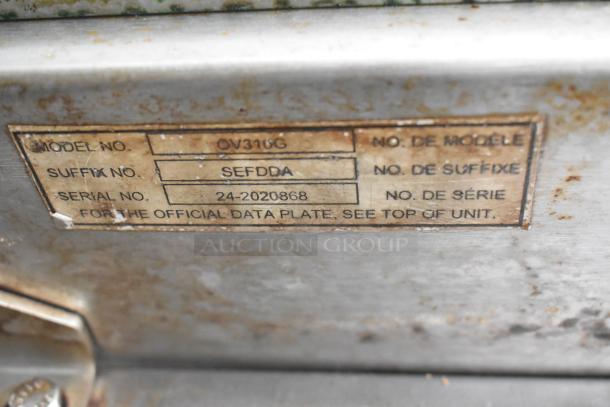 Baxter OV310G stainless steel commercial gas oven nameplate with model, suffix, and serial number details visible.