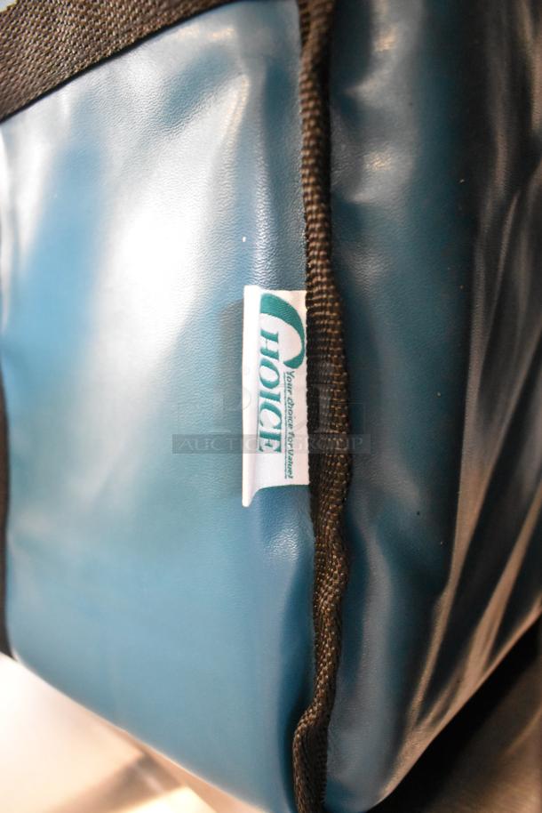 Blue and black insulated food carrying bag by Choice, featuring durable material and Choice logo tag.