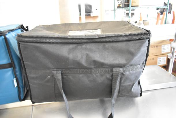 Blue and black insulated food carrying bag, "2 Choice" brand. Durable with dual handles. Ideal for keeping items hot or cold.