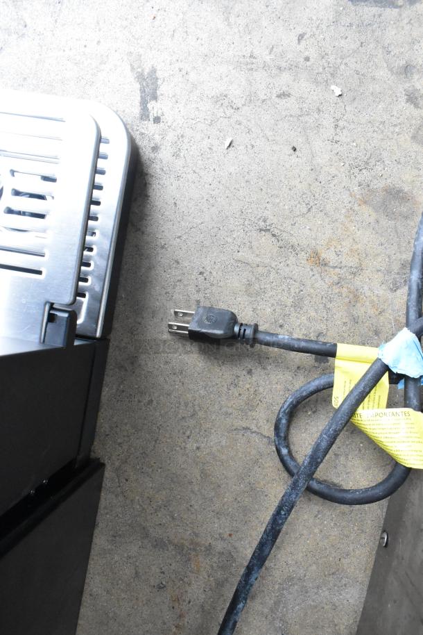 Keurig K4500 single cup coffee machine plug and cord on the ground, in good condition, 120 volts, 1 phase.