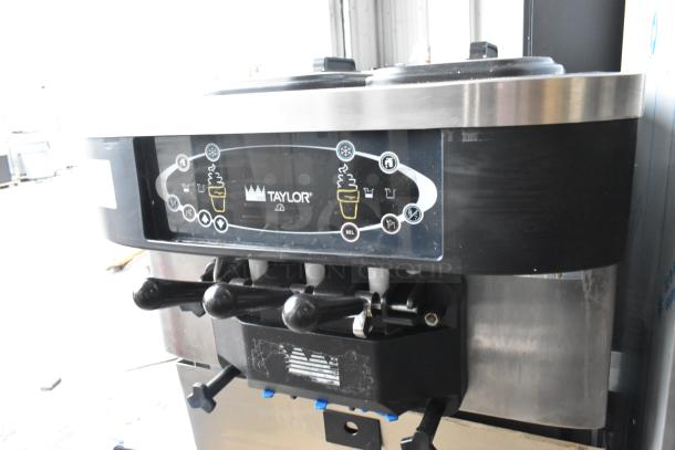 Taylor C723-33 stainless steel soft serve ice cream machine, 2-flavor with twist, floor style, water-cooled, on casters.