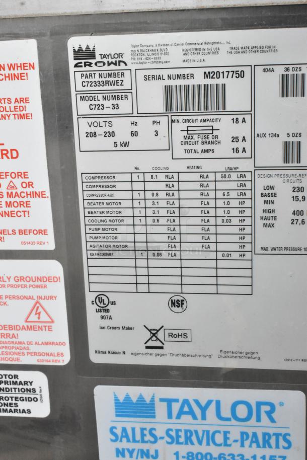 Label on a Taylor C723-33 soft serve machine showing model info, voltage (208-230V, 3 Phase), and specifications.