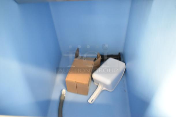 Stainless steel commercial ice bin interior with scoop and attachments for Avantco 194MCH322A ice head.