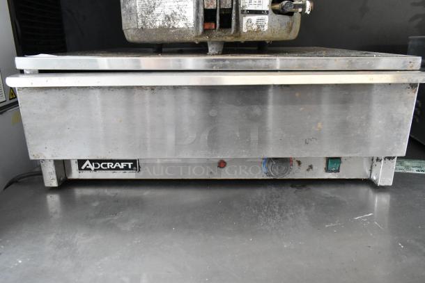 Adcraft BW-450 stainless steel bun drawer, used condition, visible wear. Includes control knobs and Adcraft label.