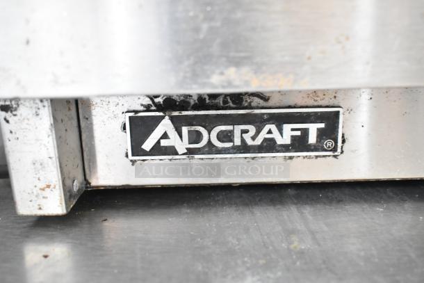 Adcraft BW-450 Stainless Steel Bun Drawer with visible Adcraft branding, showing signs of use.