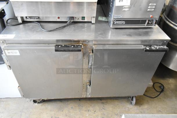 Beverage Air UCR48A stainless steel undercounter cooler with 2 doors, on commercial casters. Visible wear on handles, 115V, 1 phase.