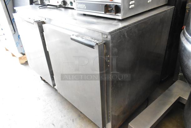 Beverage Air UCR48A stainless steel undercounter cooler, commercial casters, dual doors, 115V, 1 phase, visible wear.