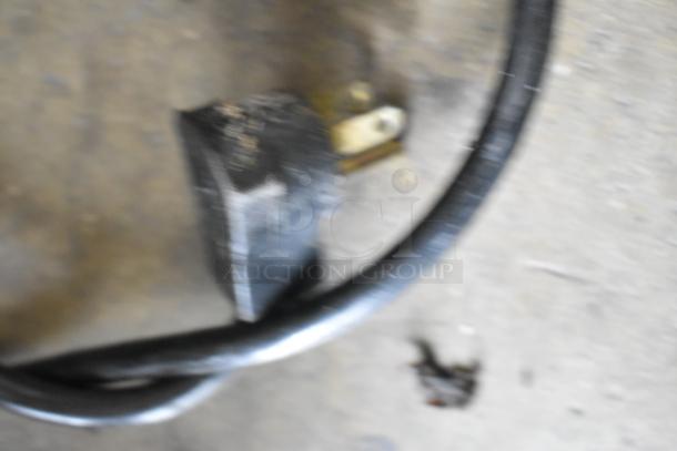 Power cord of Beverage Air UCR48A cooler, shown in focus, indicating 115 volts, 1 phase compatibility.
