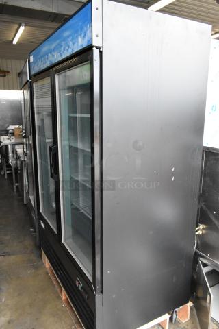 Brand new Avantco 178GDC49FHCB 53" black customizable swing glass door merchandiser freezer with LED lighting, 115V.