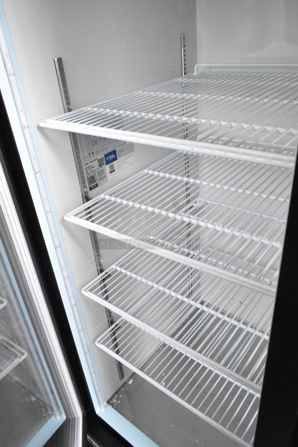 Brand new Avantco 178GDC49FHCB 53" black glass door freezer with LED lighting. Customizable shelves, 115 volts, minor scratches.