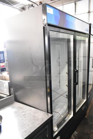 Brand new KoolMore MDR-2GD-45C metal 2-door reach-in cooler with poly coated racks, on commercial casters.