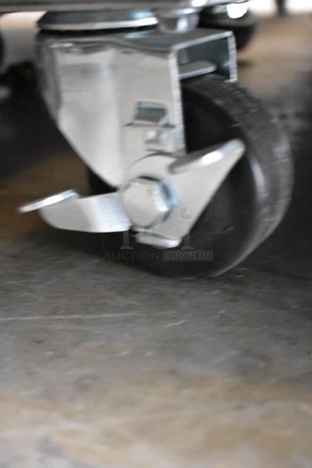 Close-up of a caster wheel from a KoolMore MDR-2GD-45C commercial cooler. Metal construction, sturdy design, on commercial casters.