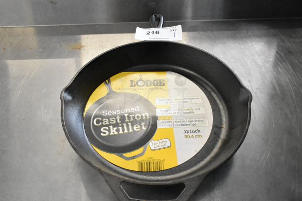 BRAND NEW Lodge Cast Iron Skillet, scratch and dent, 12-inch, pre-seasoned, label intact, durable and versatile cookware.