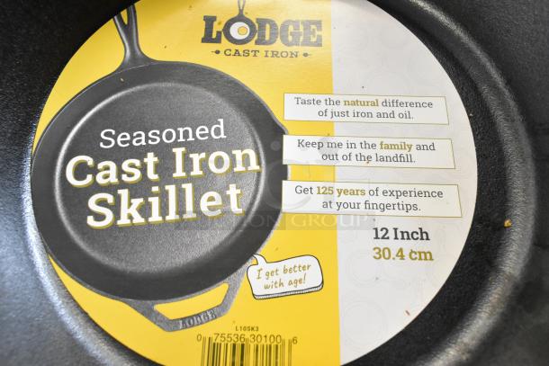 Lodge Cast Iron Skillet, 12-inch, new with scratch and dent. Seasoned, yellow label with usage tips and size info.