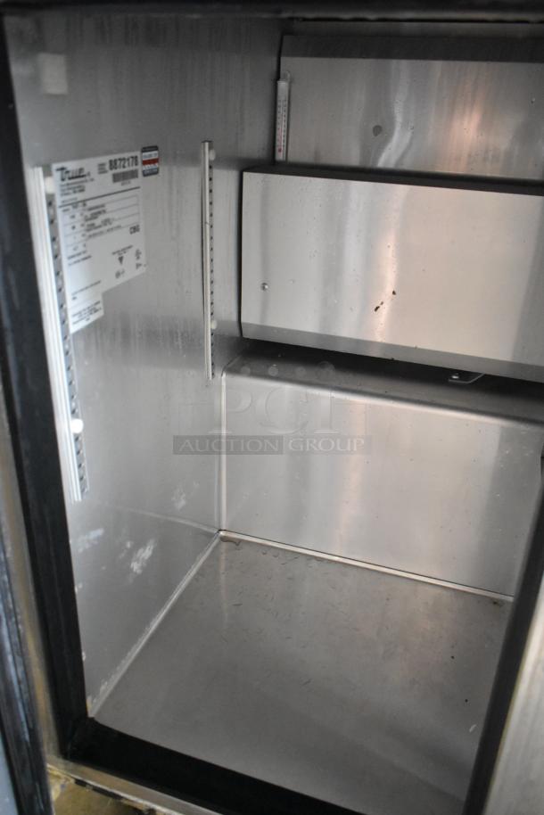 2016 True TWT-36 stainless steel 2-door work top cooler; interior view; commercial casters; 115V, 1 phase.