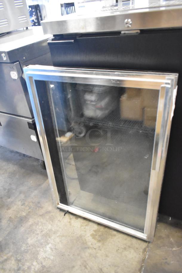 Stainless steel framed glass door, in good condition, clear pane, suitable for commercial use.