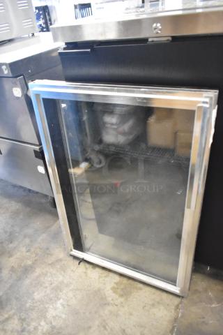 Stainless steel framed glass door, in good condition, clear pane, suitable for commercial use.