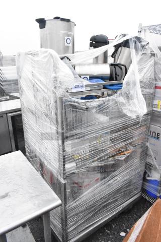 Chrome finish shelving unit wrapped in plastic, containing several air pots. Buyer must dismantle.
