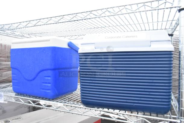 Chrome finish 5-tier wire shelving with portable coolers; includes Igloo chest and labeled "Corporate Caterers." Buyer dismantles.