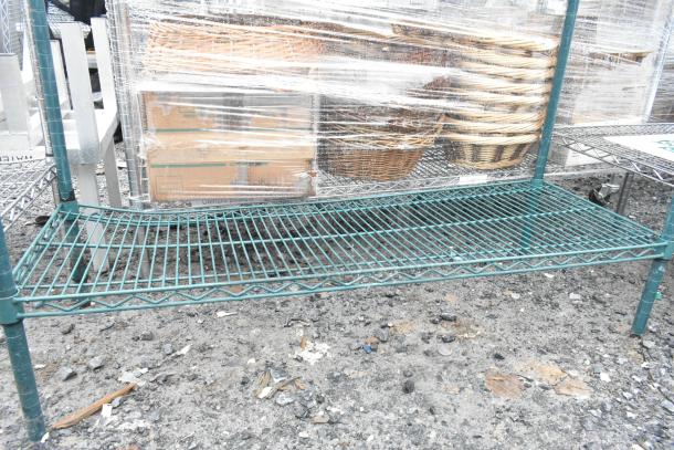 Green 2-tier wire shelving unit, sturdy design, green finish, visible wear. Buyer to dismantle, consider freight costs.