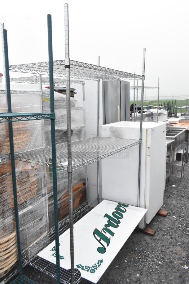 Chrome finish 3-tier wire shelving unit, good condition, dismantling required for buyer; consider freight charges.