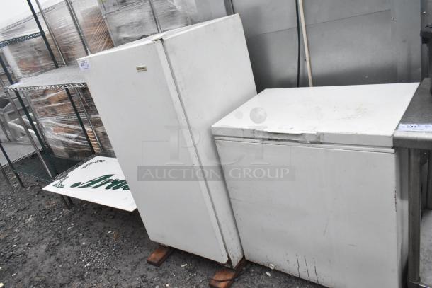 Frigidaire reach-in freezer and Kirkland chest freezer, white, used condition, 115 volts, 1 phase, standing outdoors.