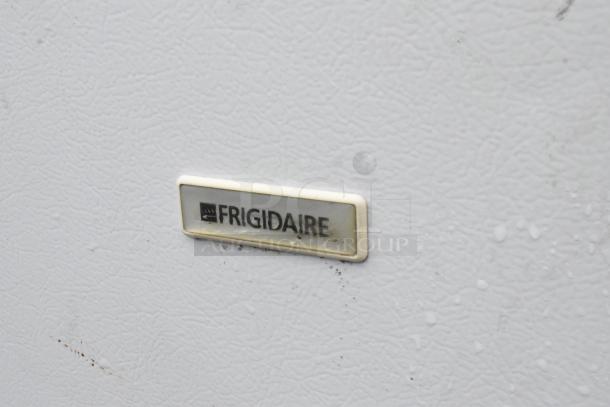 Frigidaire MFU09M2GW0 freezer label on white textured surface; part of auction set with Kirkland chest freezer, 115V, 1 phase.