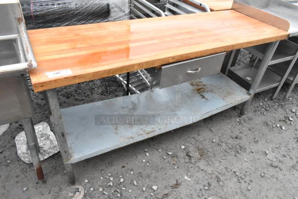 Butcher block table with wooden top, metal drawer, and under shelf. Visible wear and rust on metal parts. Item tag: "240."