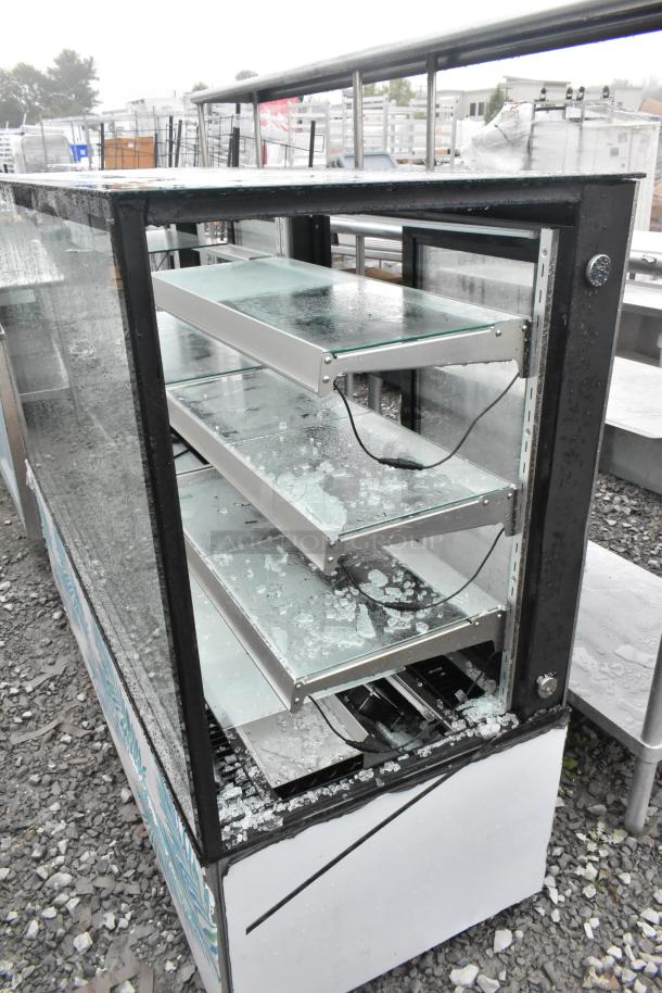 Omcan RS-CN-0571-S commercial deli display case with broken glass, metal shelves, floor style, used condition.