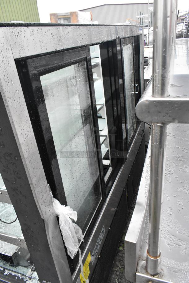 Omcan RS-CN-0571-S deli display case with visible broken glass; commercial floor style merchandiser.
