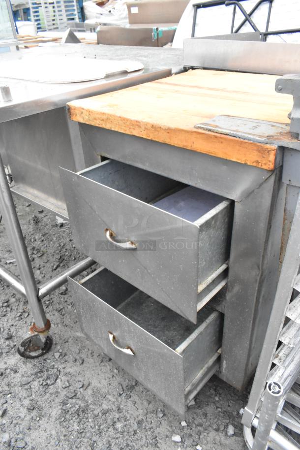 Metal commercial counter with a butcher block countertop, mounted can opener, and two drawers. Used condition.