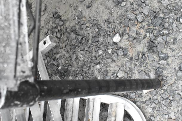 Black finish 3-tier wire shelving unit with a floor mat, partially visible in the image. Buyer must dismantle.