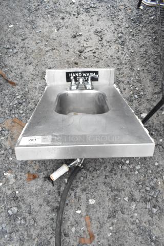 Stainless steel single bay tabletop sink with "Hand Wash Only" label, includes faucet, visible water connections, used condition.