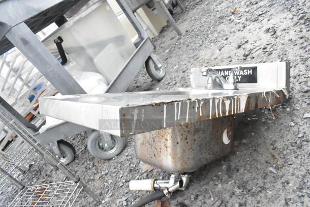Stainless steel single bay tabletop sink with faucet, marked "Hand Wash Only." Shows signs of rust and wear.