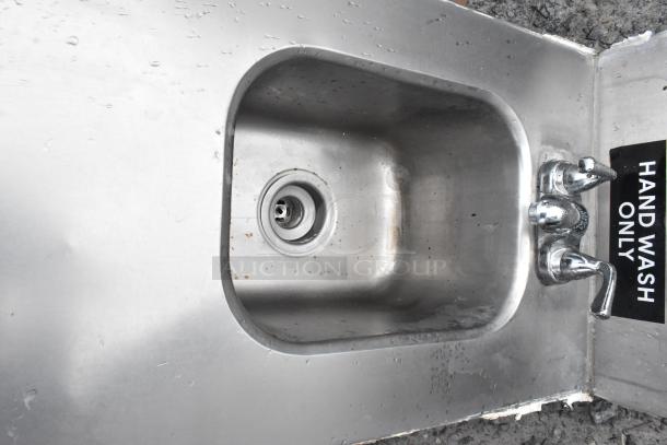 Stainless steel single bay tabletop sink with dual faucets and "Hand Wash Only" label, in used condition.