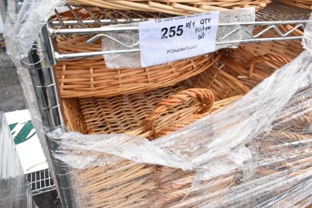 Chrome finish 4-tier wire shelving unit with wicker baskets, wrapped in plastic. Buyer must dismantle. Item labeled "255."