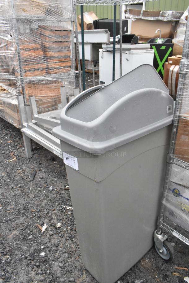 Gray Poly Slim Jim Trash Can, durable plastic, slim design, used condition, visible lot and quantity labels.