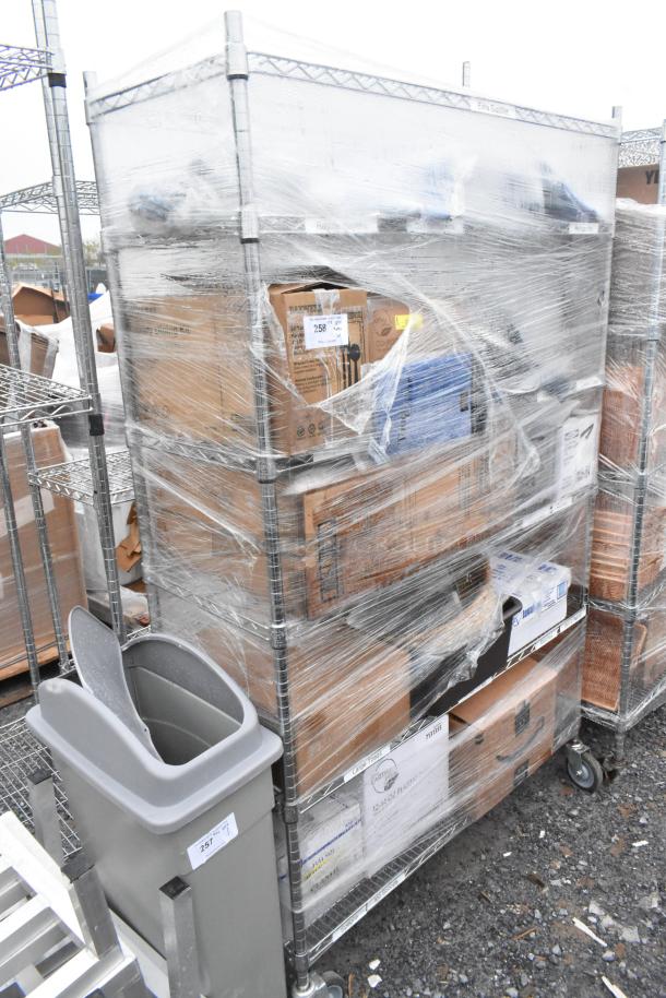 Chrome 6-tier wire shelving unit with contents, including plasticware. Buyer must dismantle. Freight charges apply.