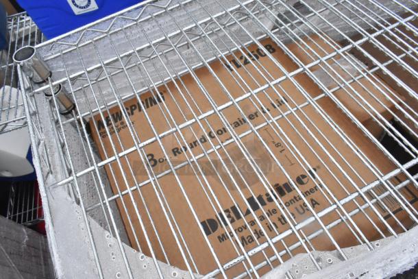Chrome finish 6-tier wire shelving unit with plastic lids. Includes packaging label. Buyer dismantles. Consider freight charges.