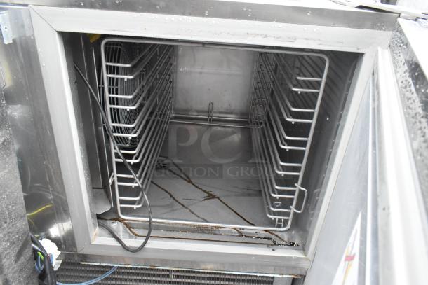 Electrolux Stainless Steel Commercial Air-o-chill Blast Chiller, interior view, shelving racks, visible wiring, used condition.