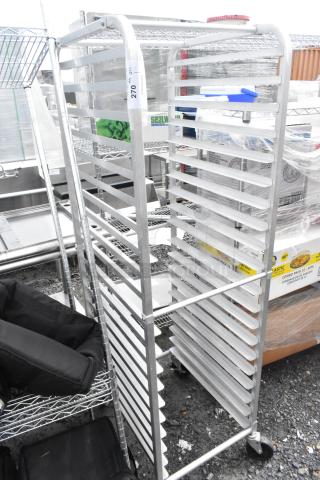 Metal pan transport rack with multiple shelves, commercial casters, and a visible label showing "270 H- QTY", suitable for kitchen use.