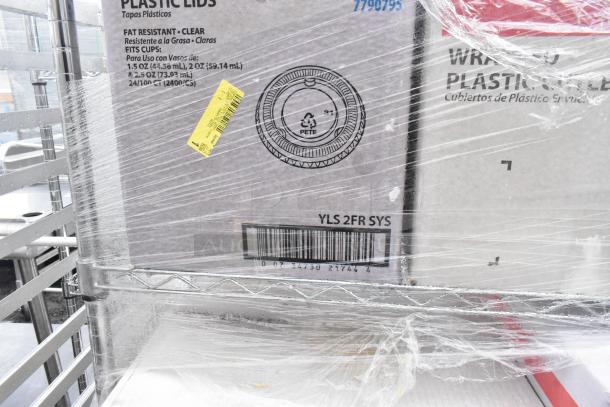 Chrome wire shelving unit on commercial casters with wrapped contents. Buyer must dismantle. Consider freight costs.